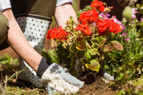 Safety signage and first aid kit at a garden worksite